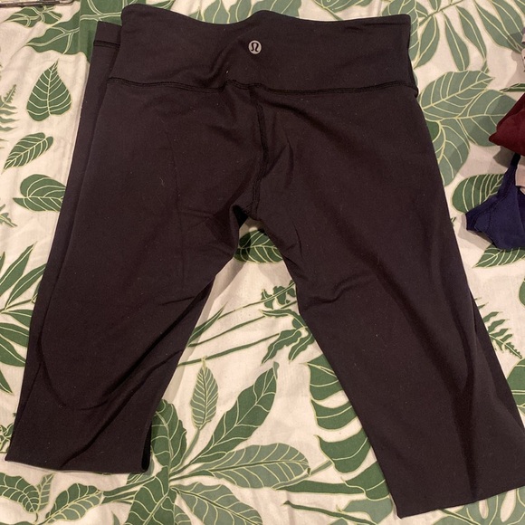 Bundle of lululemon women’s clothes: sports bras, running shorts, and leggings. - Picture 5 of 8